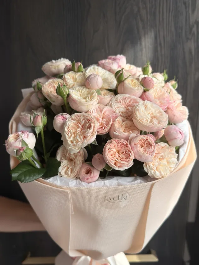 Blush garden rose bouquet in soft neutral wrapping