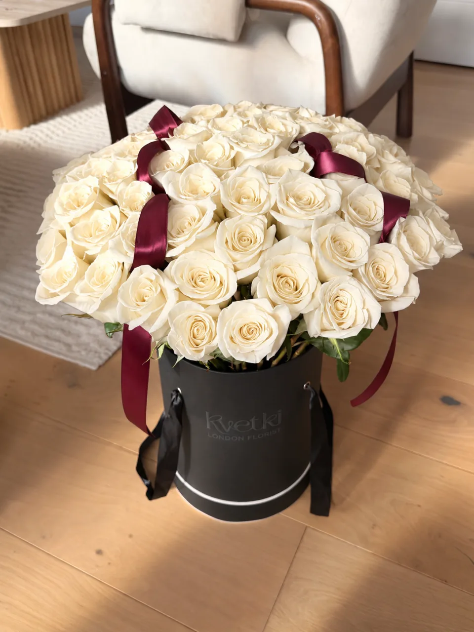 Premium white Avalanche roses in a hatbox