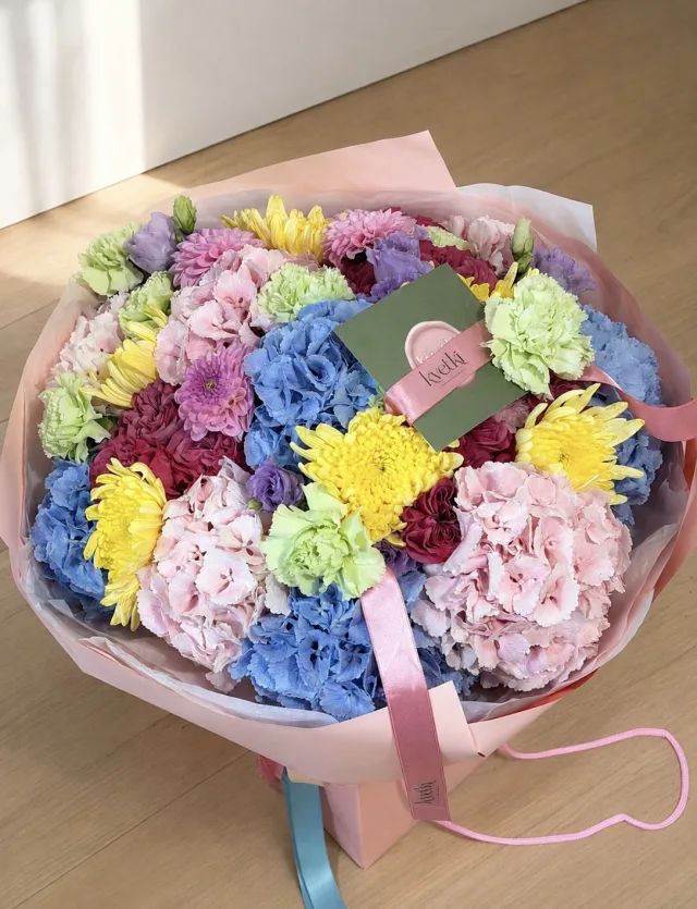 Pastel blue pink yellow and green hydrangea bouquet