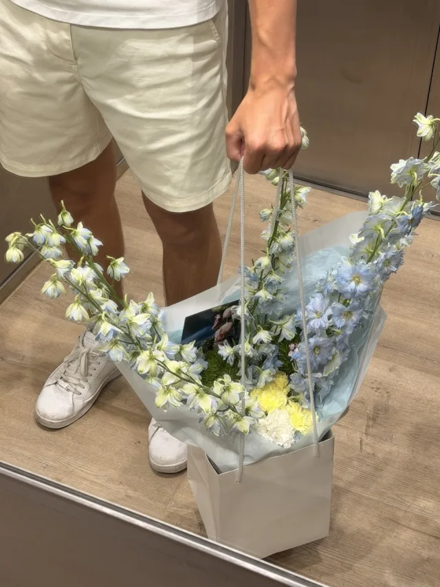 Tall blue and white delphinium bouquet